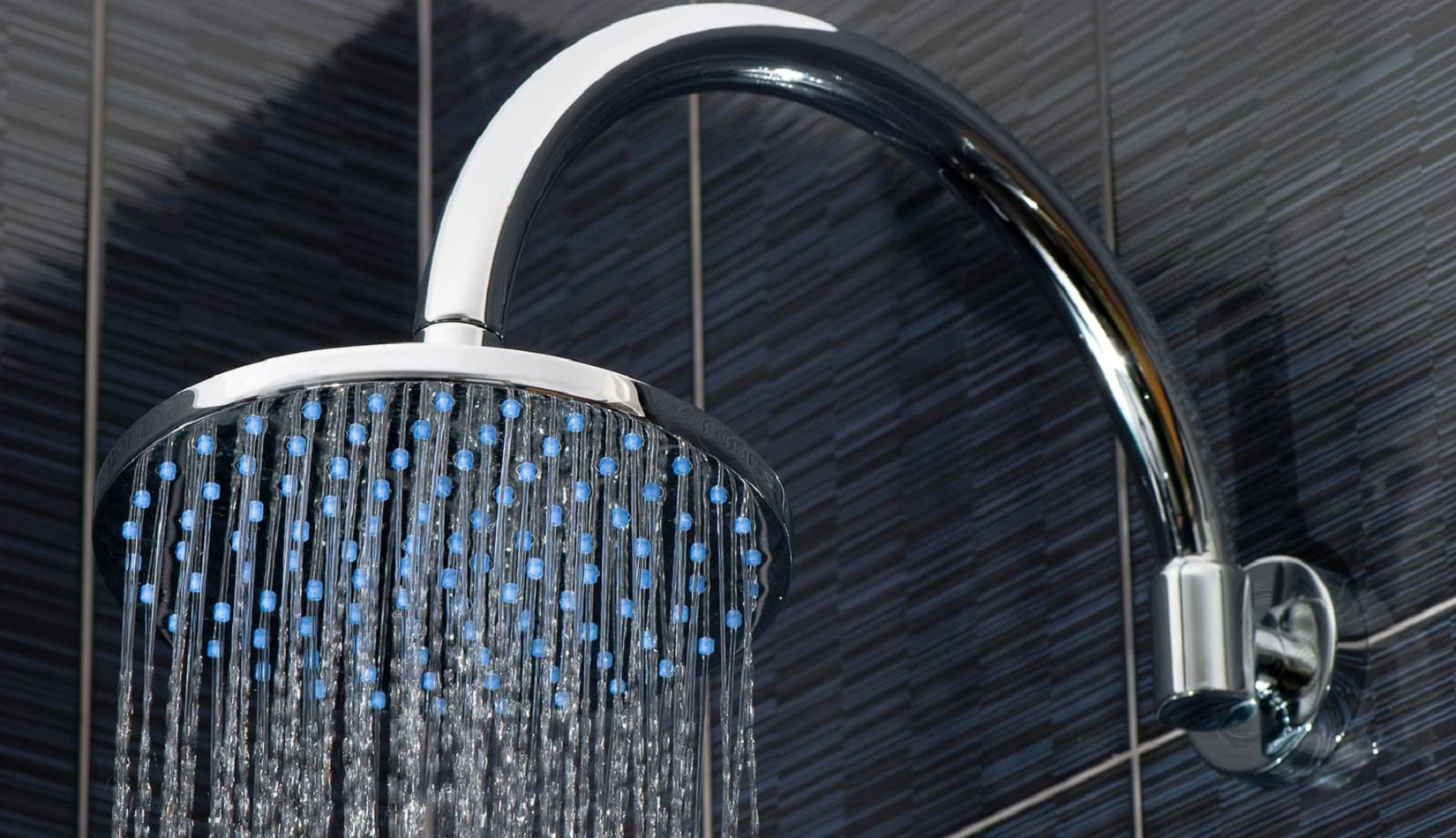 Shower installation in Kingman, featuring custom tiled designs and glass enclosures for a modern bathroom upgrade.
